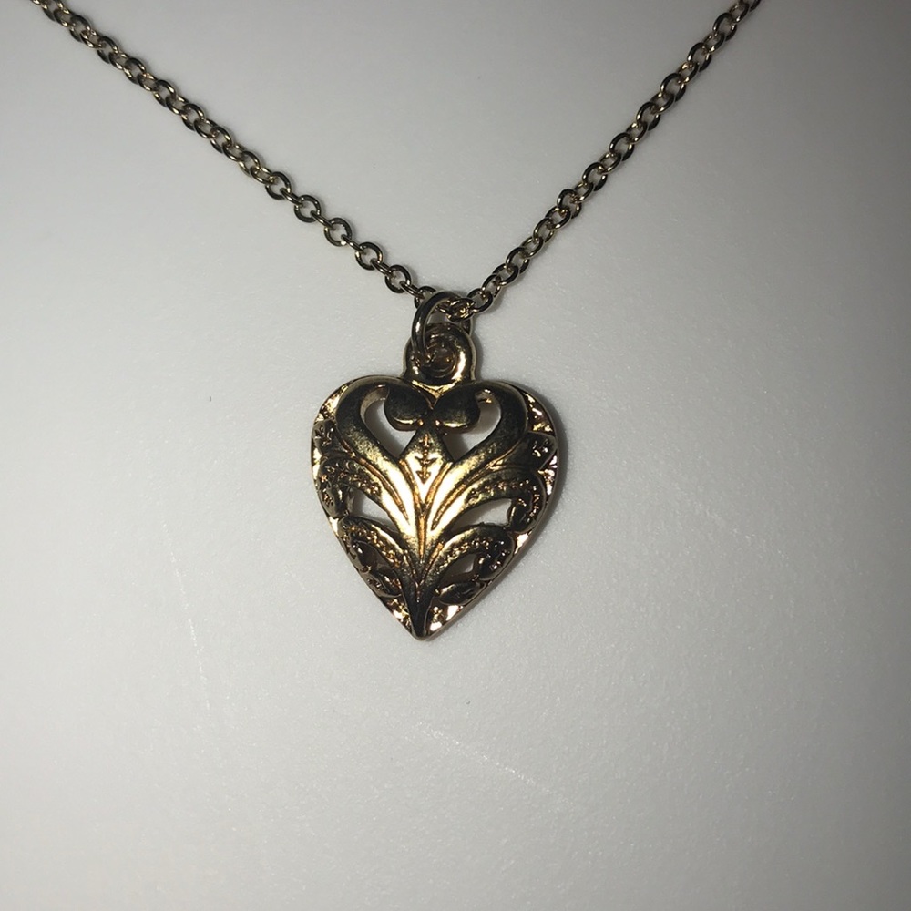 Gold tone heart necklace. 17” chain.